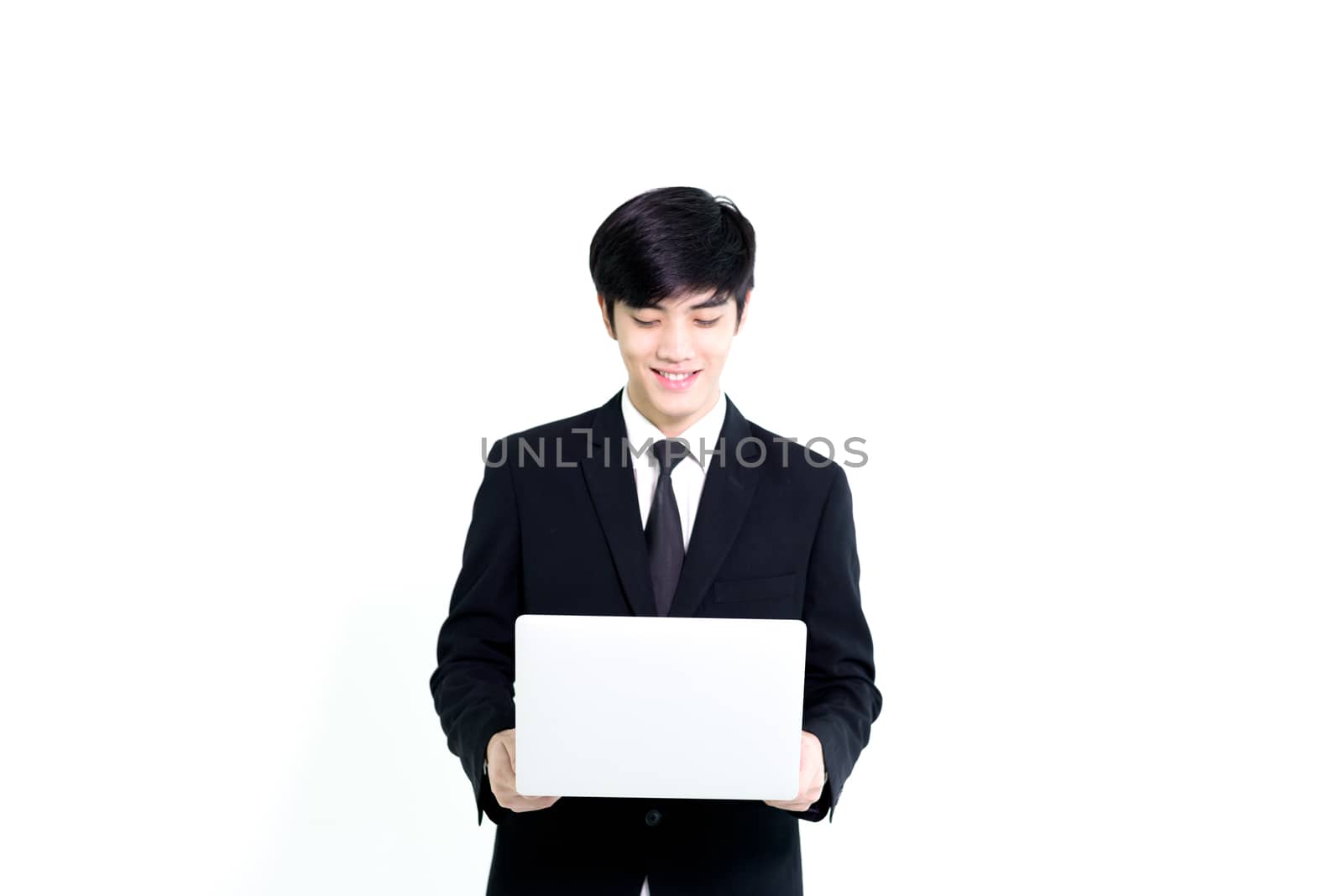 Asian business handsome man has holding laptop for woking with h by animagesdesign