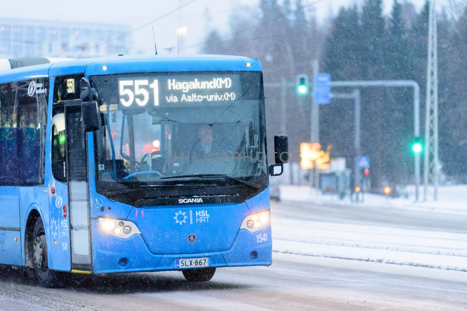 Editorial: Helsinki City, Finland, 21th December 2018. Bus on the road with snow in winter season at Helsinki, Finland.