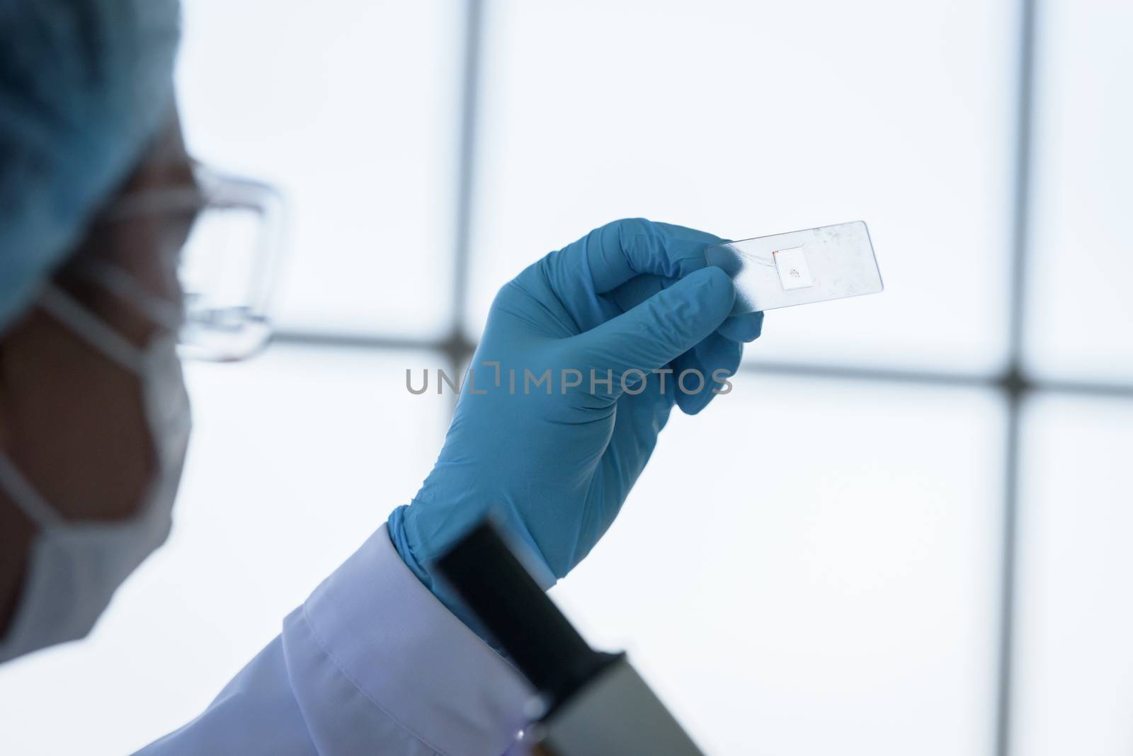 Asian man scientist researching  and learning in a laboratory.