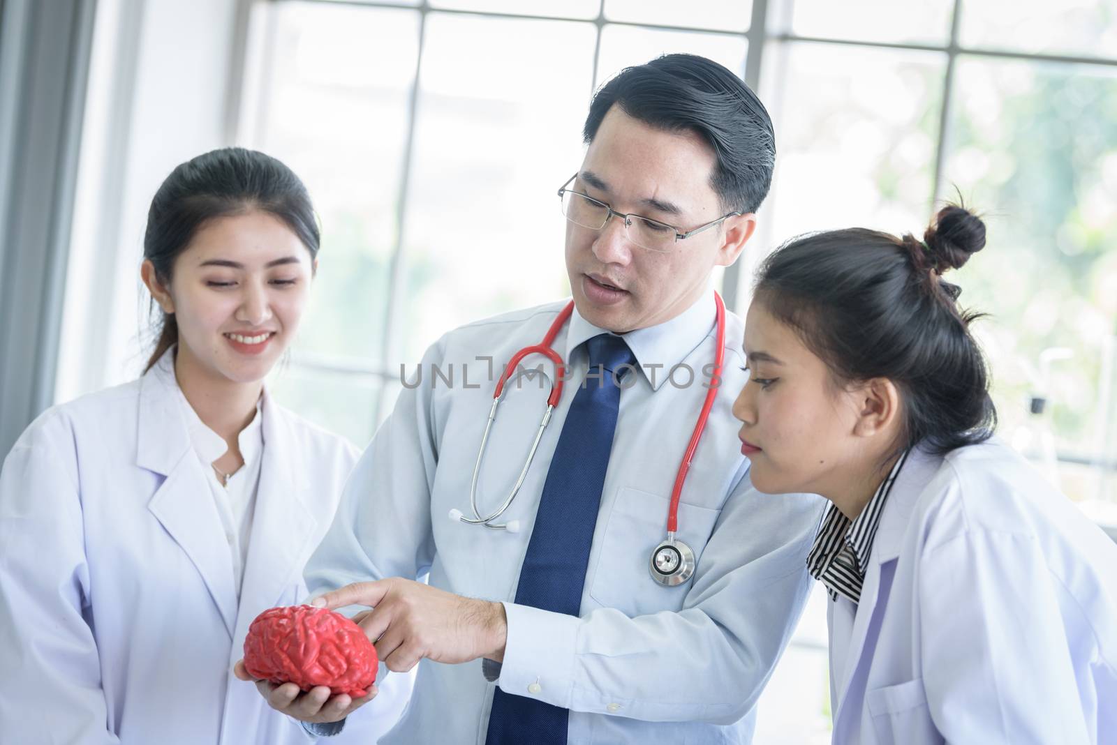 Asian teacher has teaching to student about science and anatomic by animagesdesign