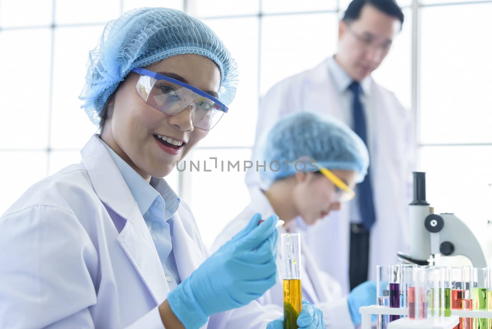 Asian young girl student scientist researching  and learning in a laboratory.