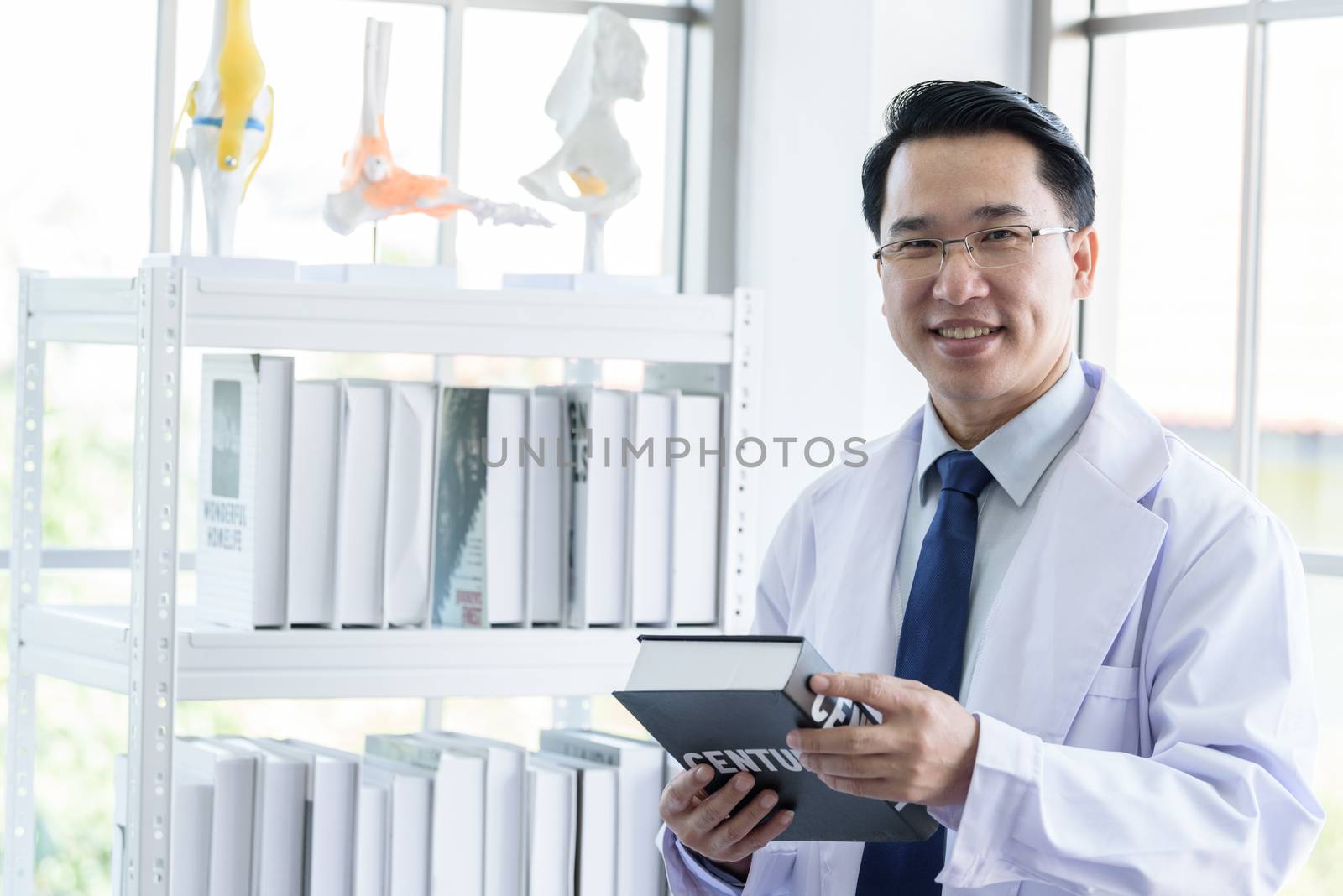 Asian senior scientist researching and learning in a laboratory.