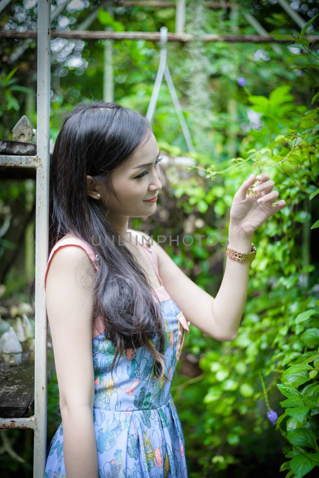 Asian pretty girl has relaxing with happy and smiling at Little  by animagesdesign