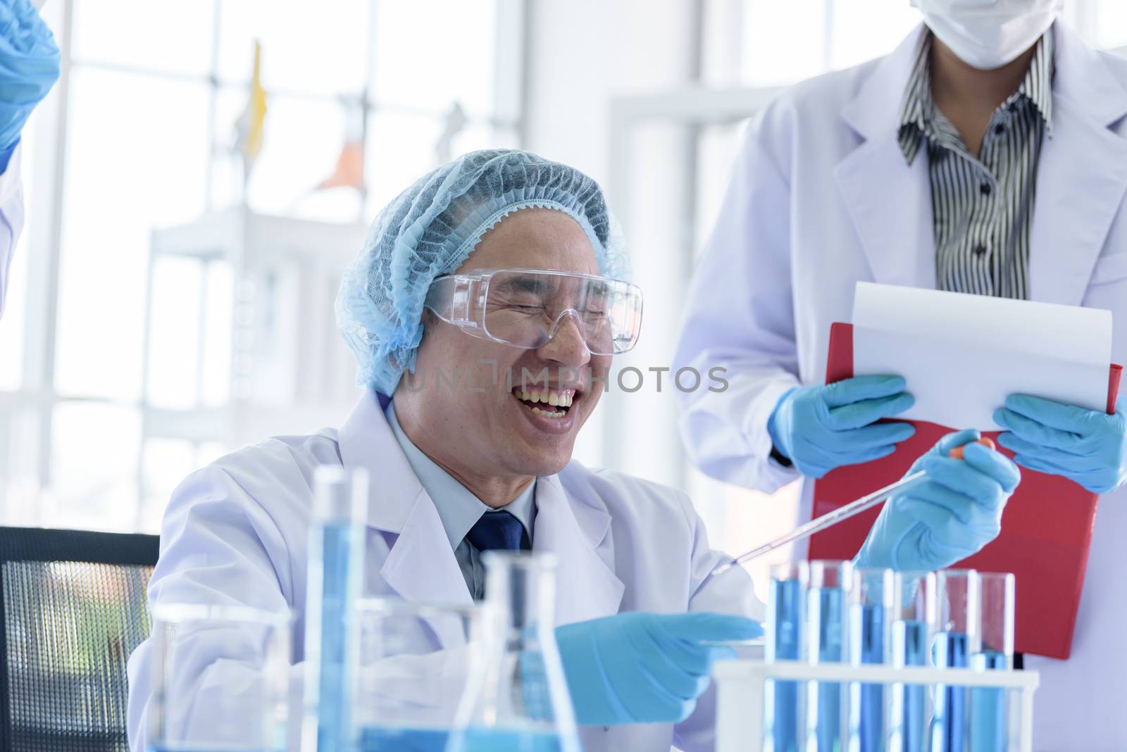 Asian senior scientist male researching and learning in a laboratory.