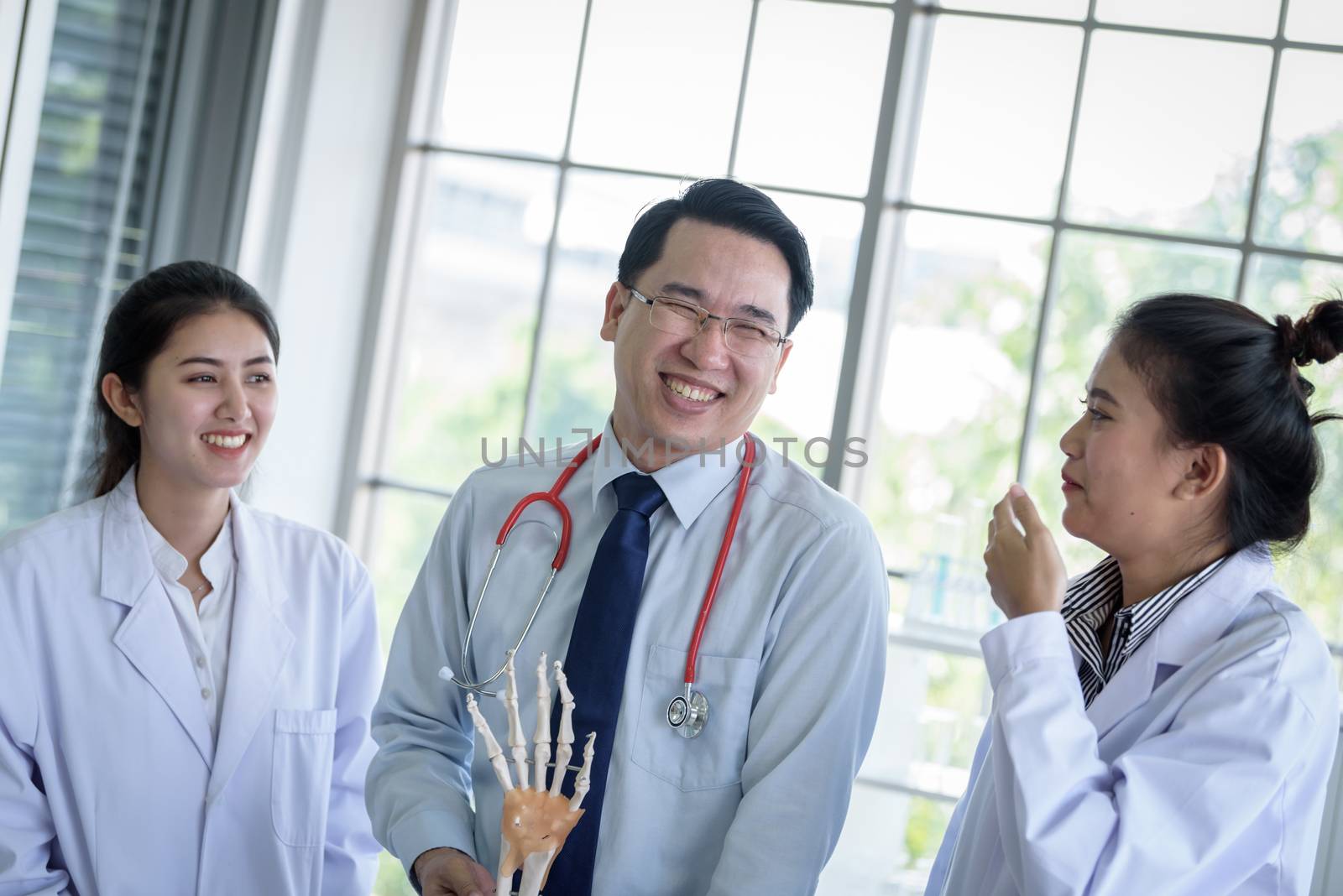 Asian teacher has teaching to student about science and anatomical in laboratory