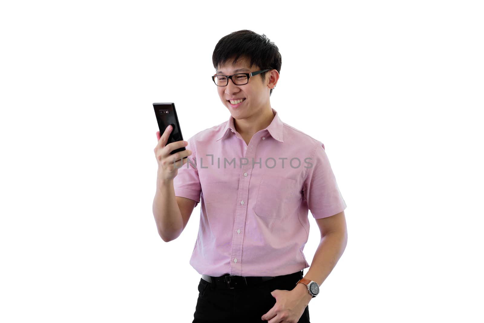 Asian young businessman has standing and playing phone with happ by animagesdesign