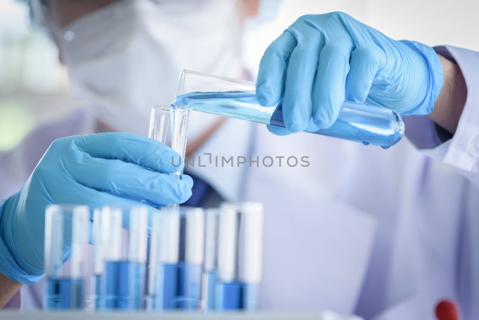 Asian man scientist researching  and learning in a laboratory.