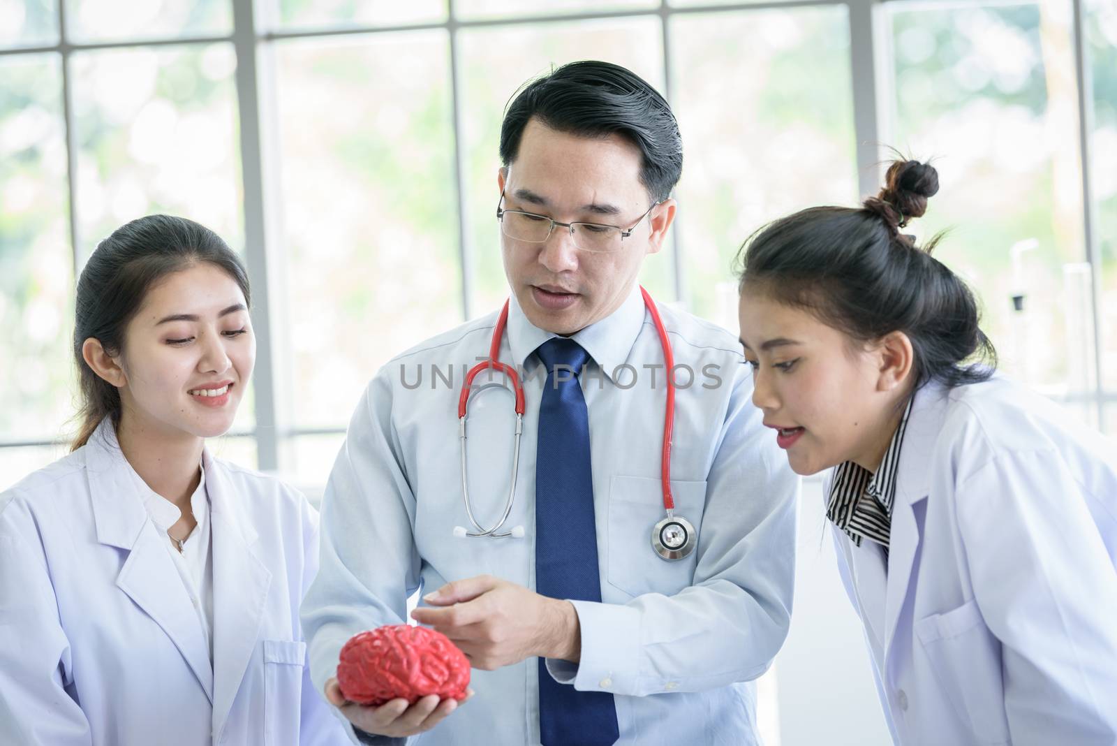 Asian teacher has teaching to student about science and anatomical in laboratory