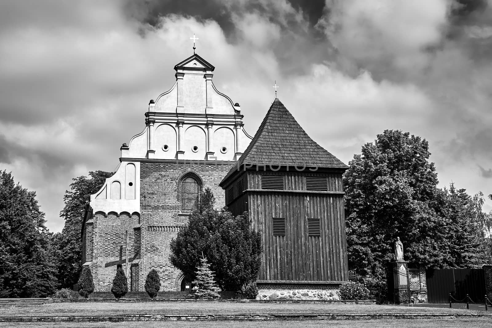 wooden belfry of the historic Gothic church in Poznan, black and white