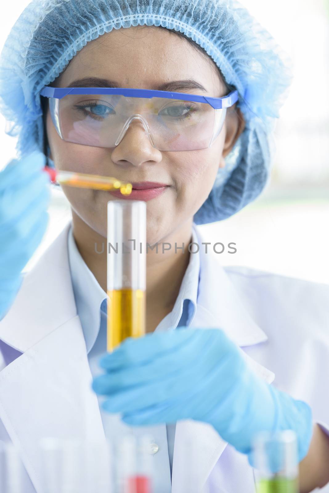 Asian young girl student scientist researching  and learning in a laboratory.