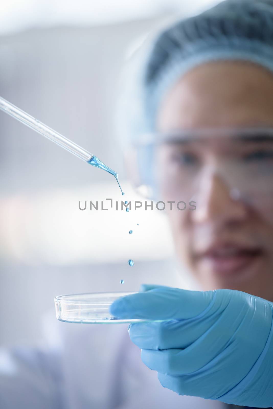 Asian senior scientist male researching and learning in a laboratory.