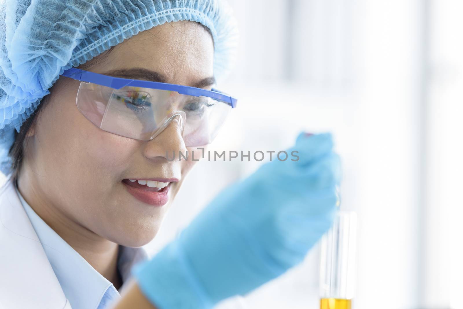 Asian young girl student scientist researching  and learning in a laboratory.