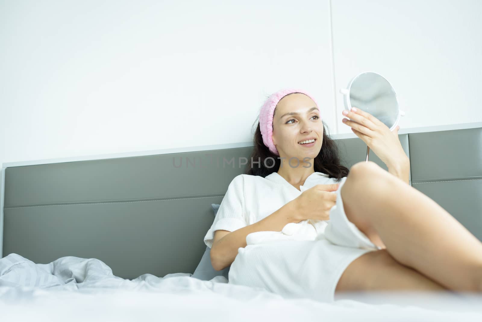 A beautiful woman wearing a towel and a white bathrobe and pink  by animagesdesign