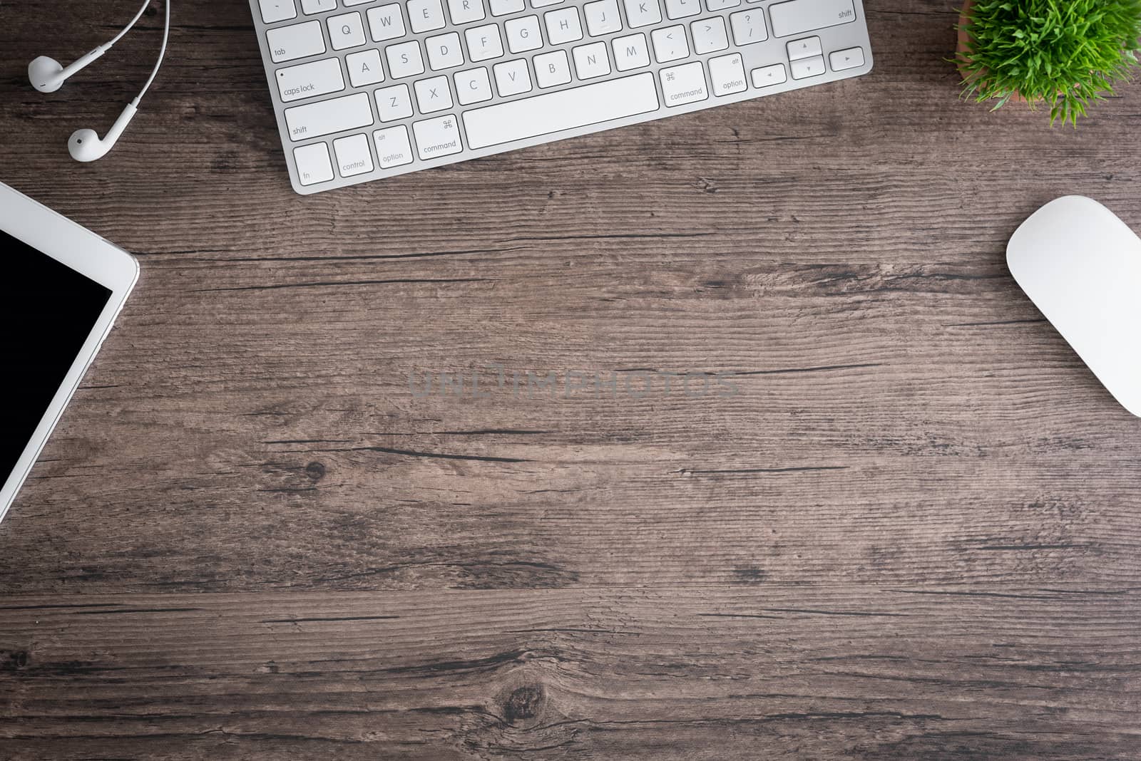 The office desk flat lay view with keyboard, mouse, tree and ear by animagesdesign