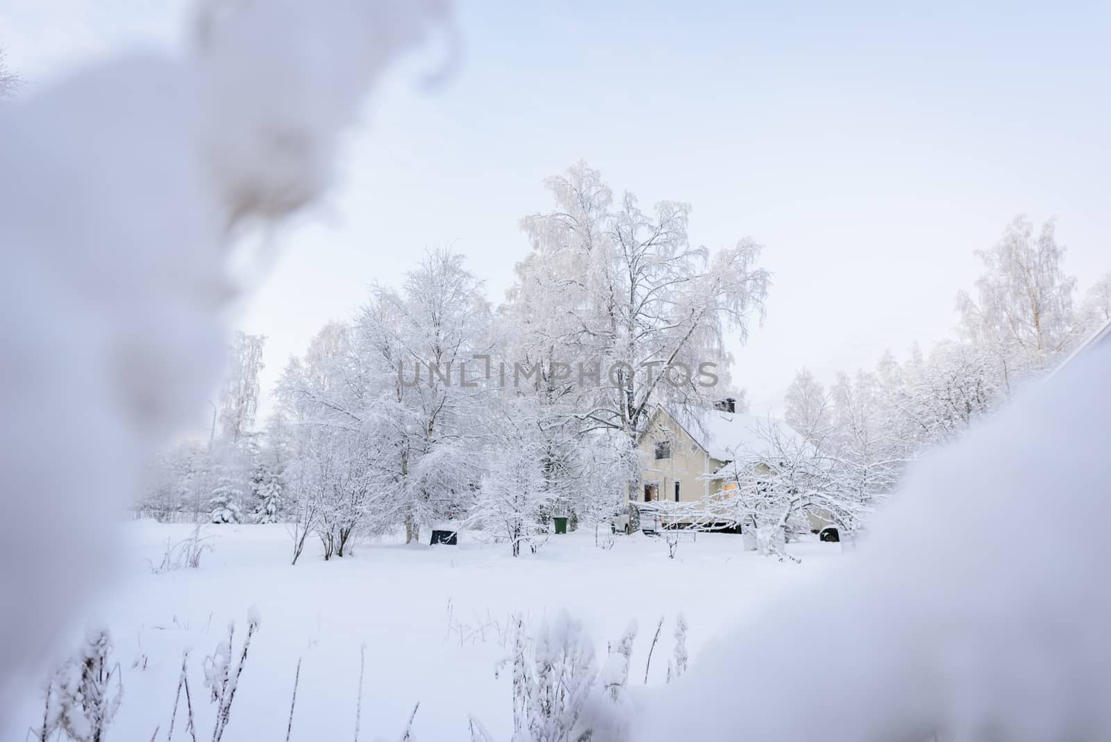 The house in the forest has covered with heavy snow in winter season at Lapland, Finland.