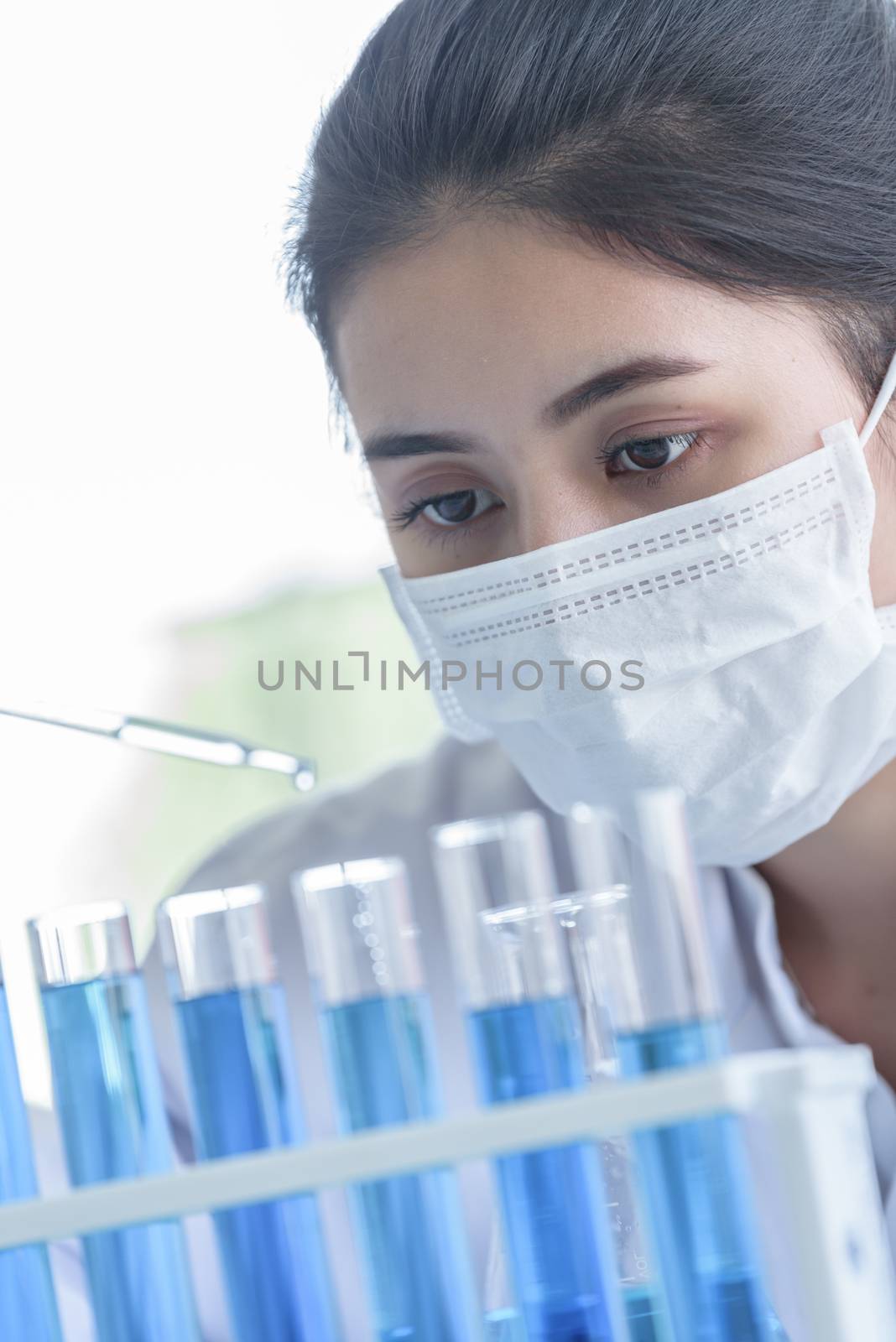 Asian young girl student scientist researching  and learning in a laboratory.