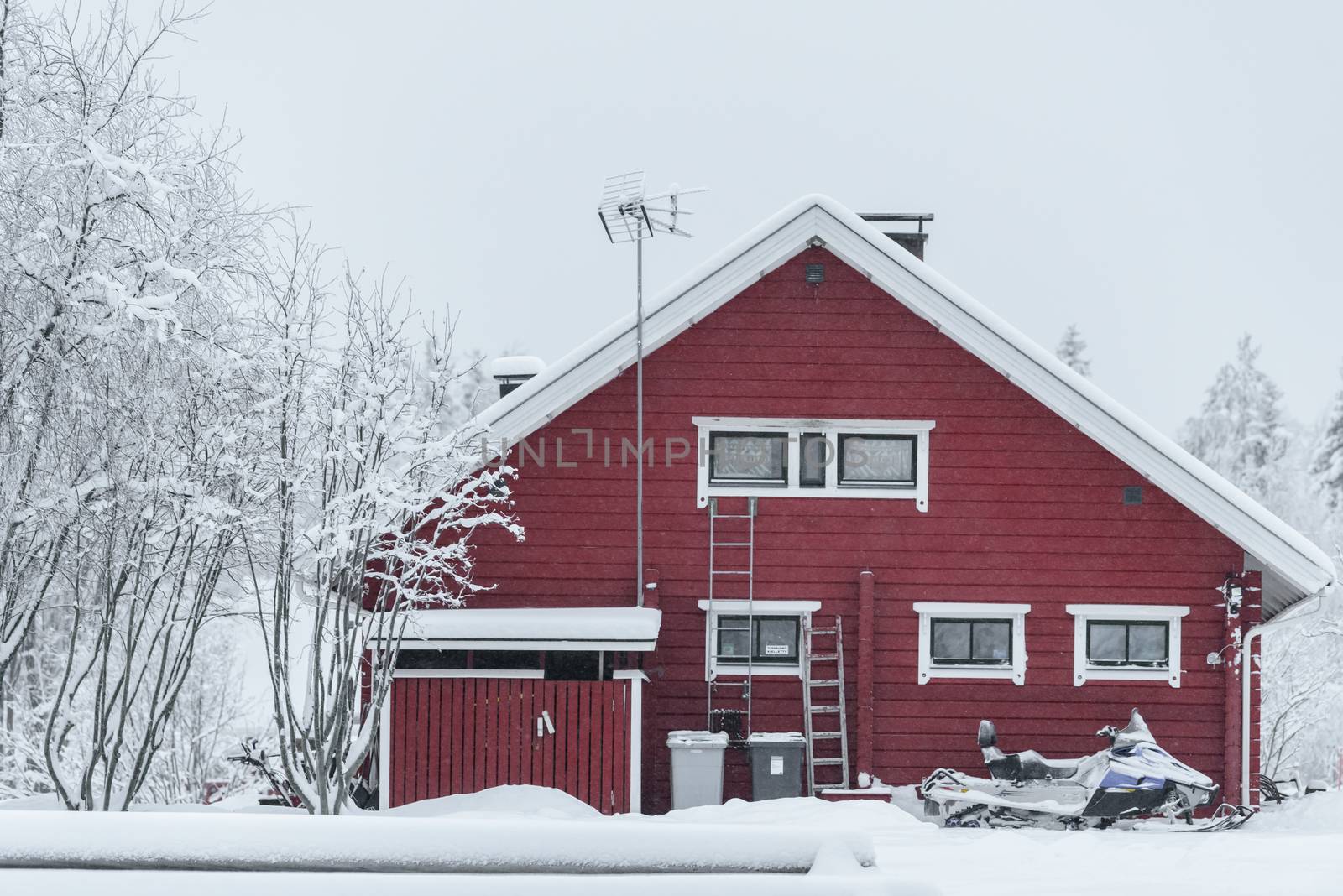 The house in the forest has covered with heavy snow and bad sky  by animagesdesign