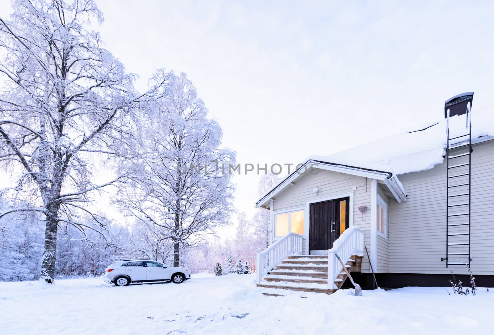 The house in the forest has covered with heavy snow in winter season at Lapland, Finland.