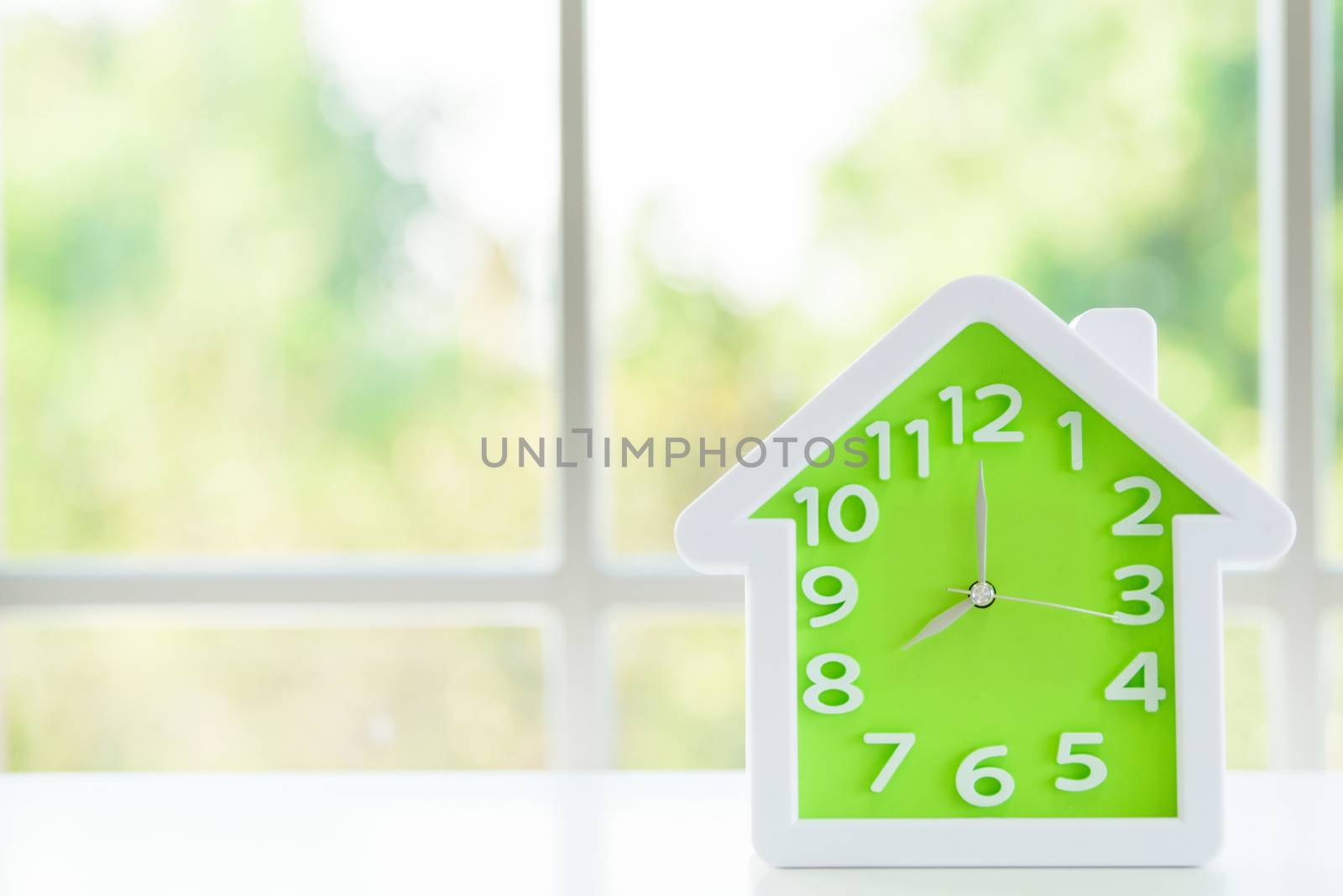The clock model with 8 a.m. and window background in the morning by animagesdesign
