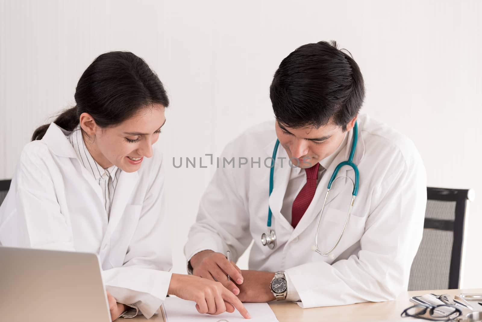 Two doctors have working together with happiness in the hospital.