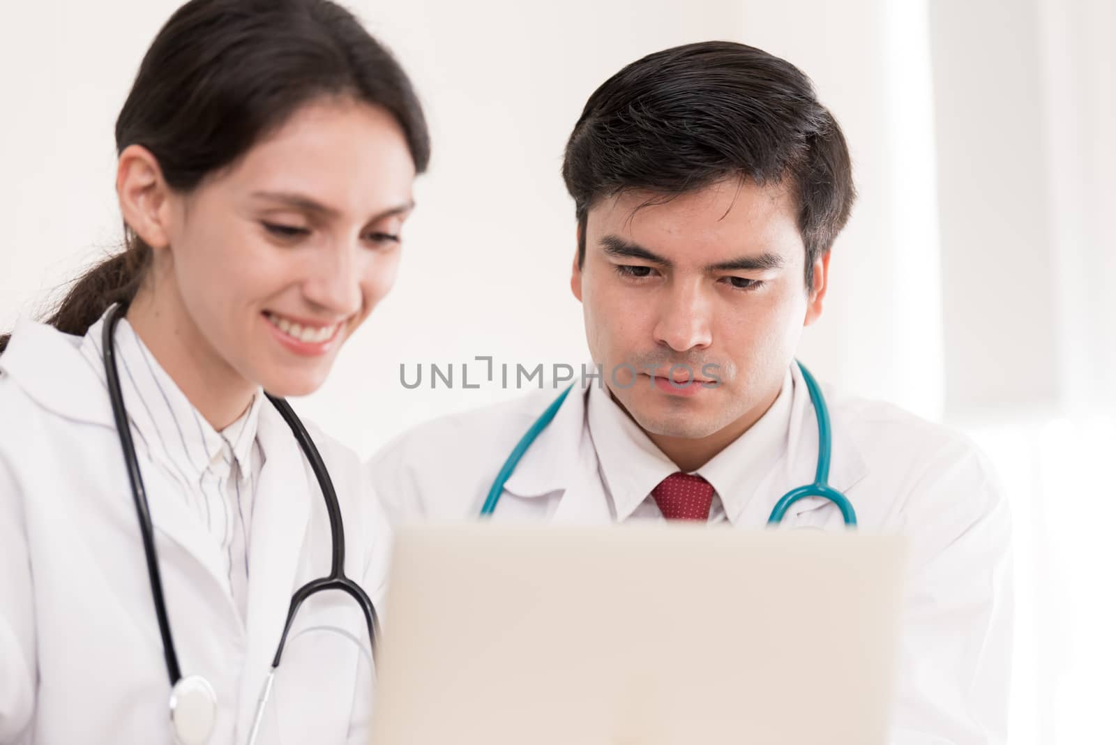 Two doctors have working together with happiness in the hospital.