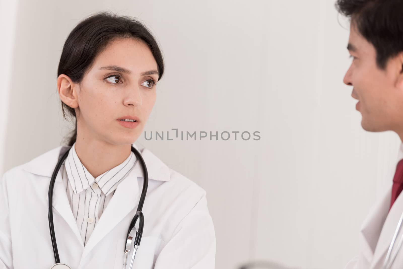 Two doctors have working together with happiness in the hospital.