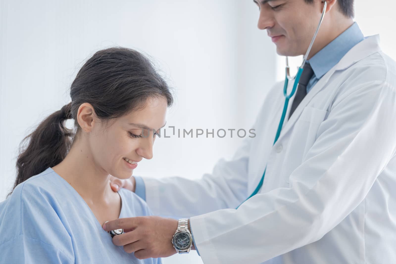 A doctor take care of sick patient woman at the hospital or medical clinic.