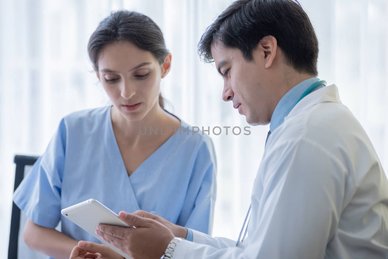 A doctor take care of sick patient woman at the hospital or medical clinic.