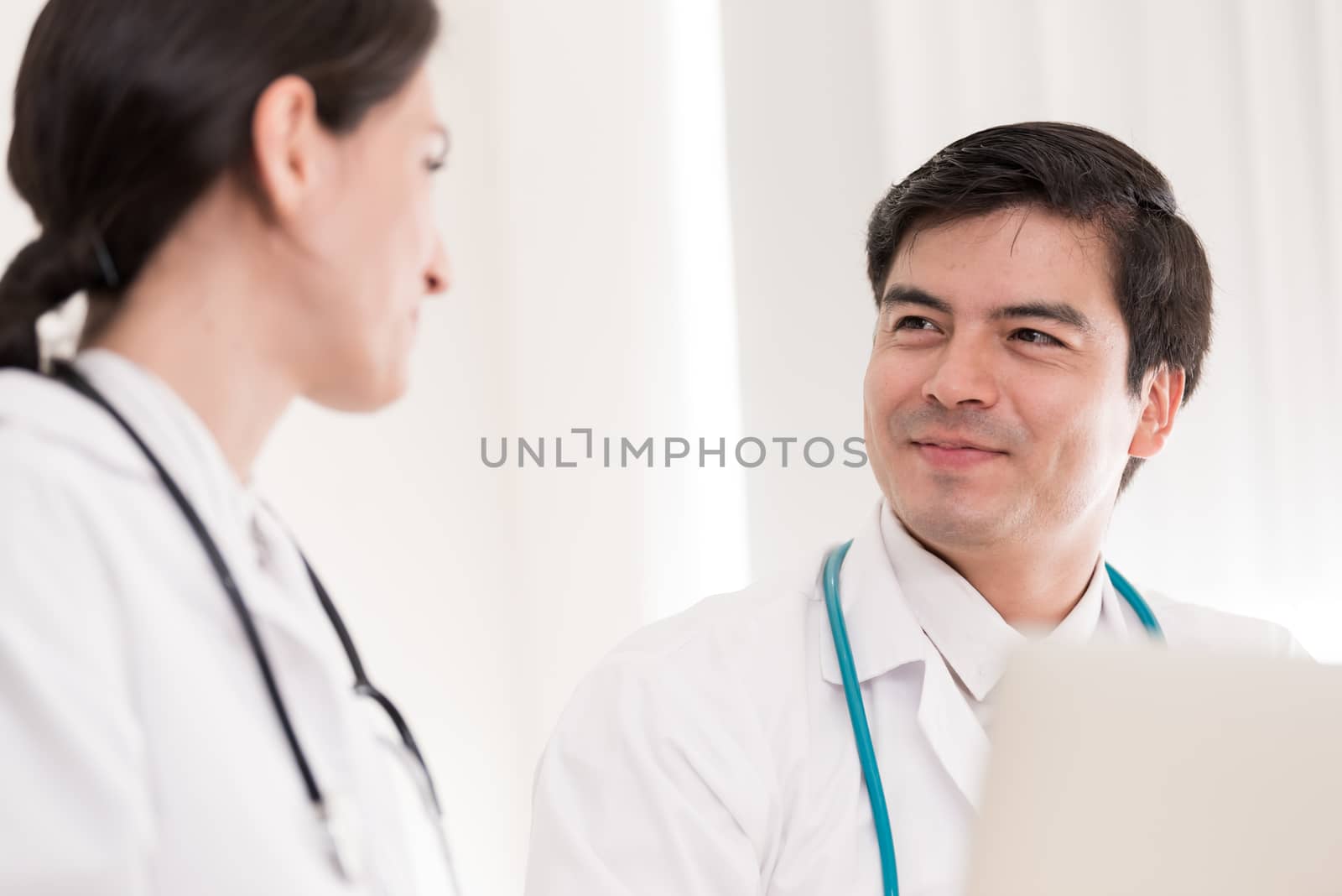 Two doctors have working together with happiness in the hospital.