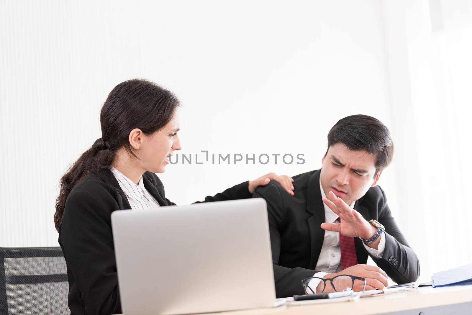 A businesswoman has upset with to sleep of the workmate in the working time at the office.