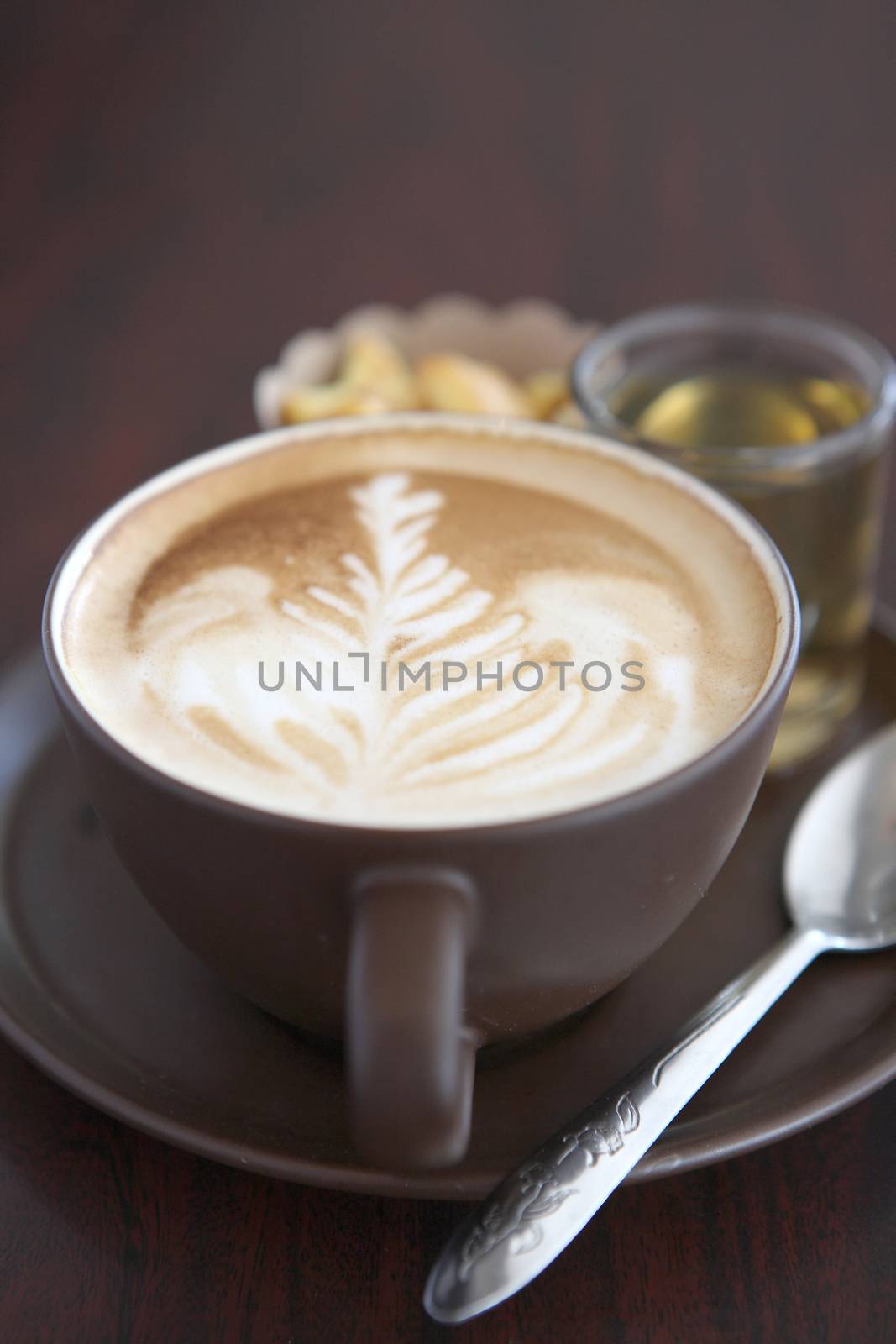 coffee in wood background by piyato