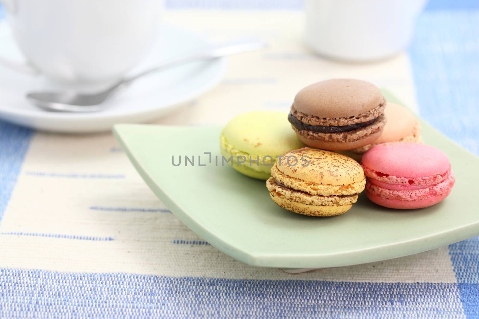 Macaron with coffee cup in white background by piyato