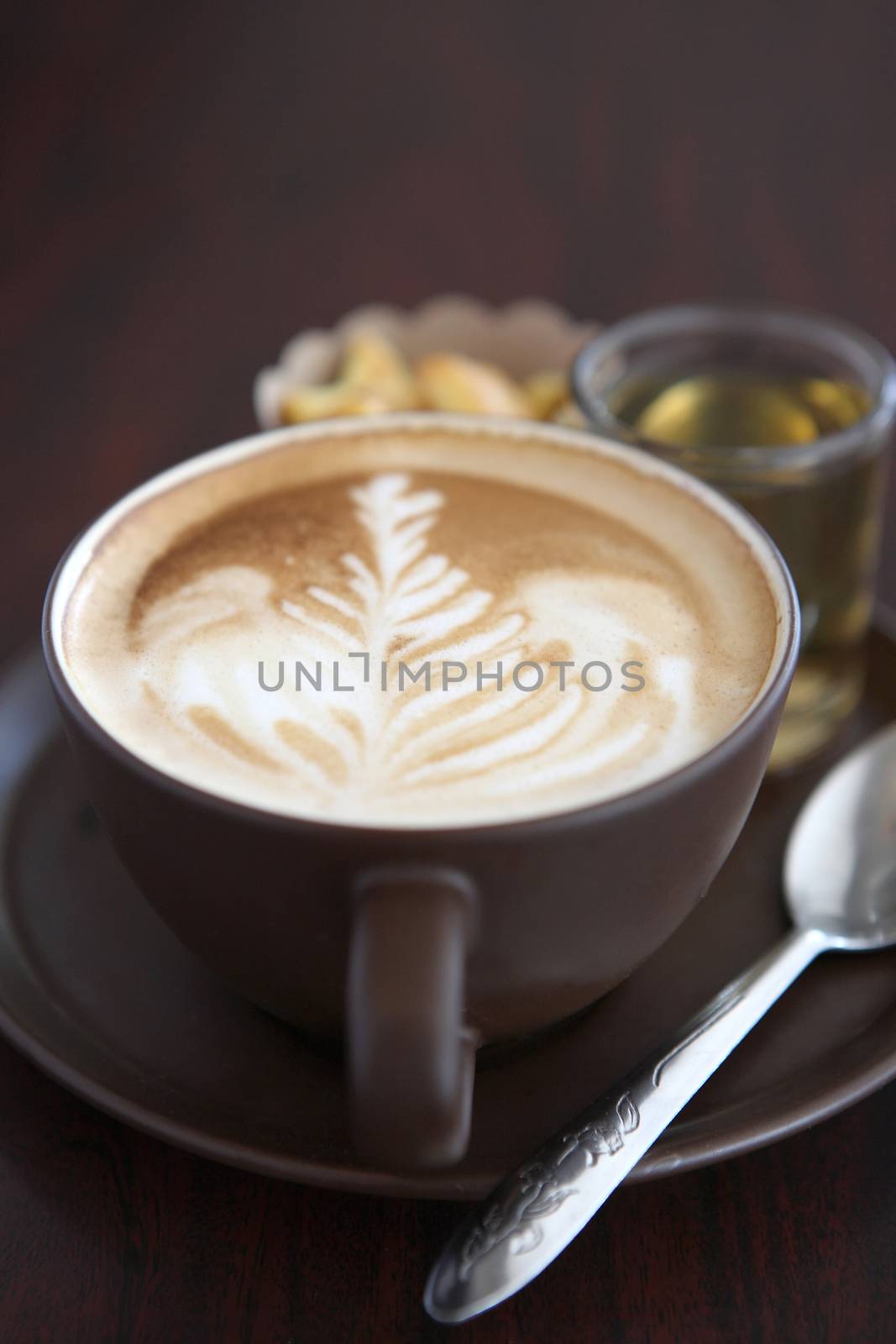 coffee in wood background by piyato