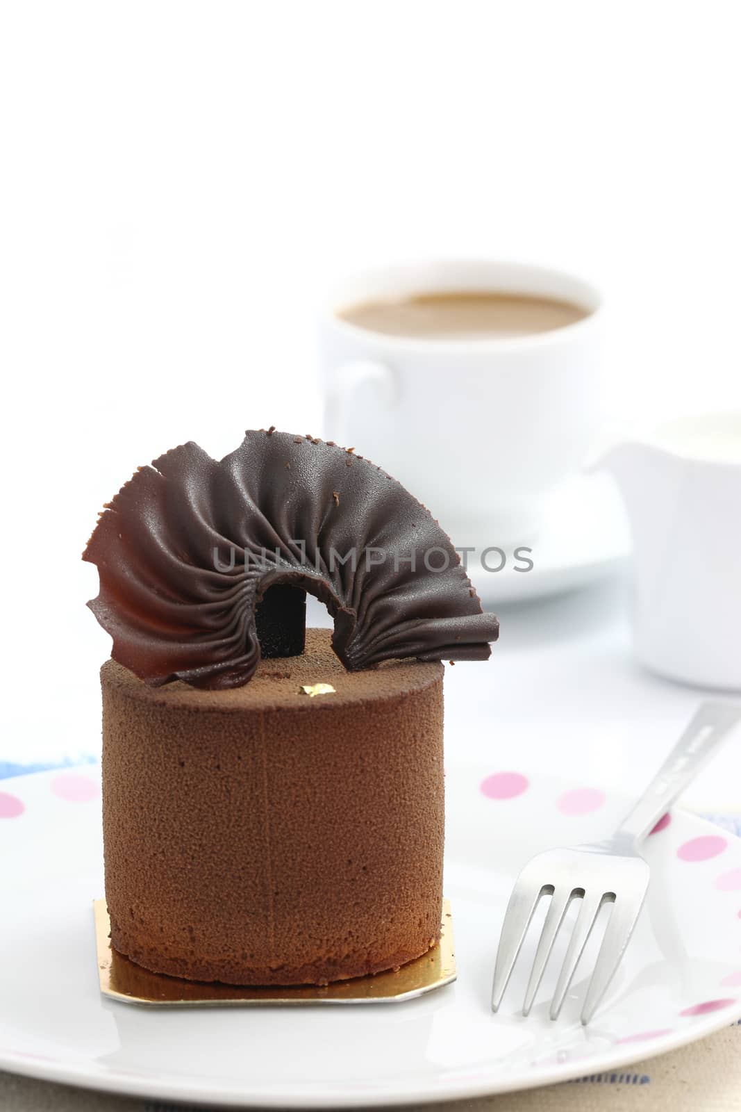 Chocolate Cake with coffee isolated in white background by piyato