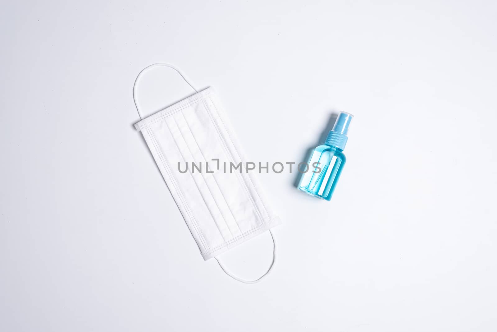 The equipment to protect COVID-19, white mask and hand cleaner gel with Isolated on white background concept.