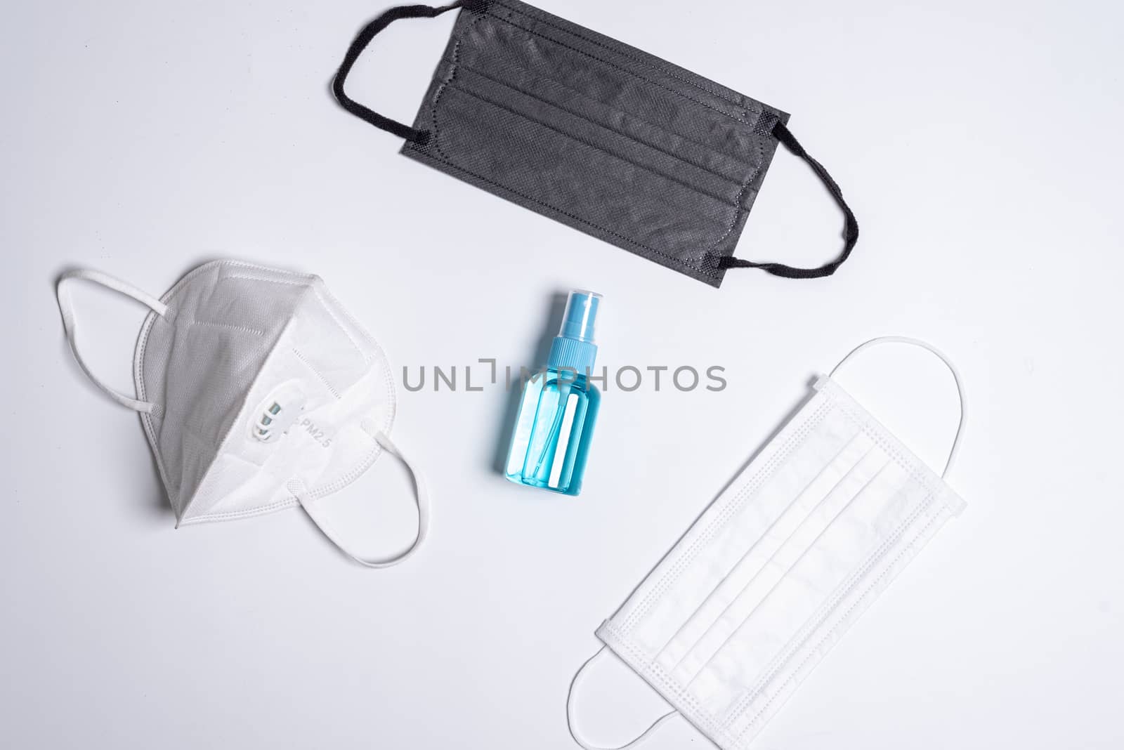 The equipment to protect COVID-19, multi color mask and hand cleaner gel with Isolated on white background concept.