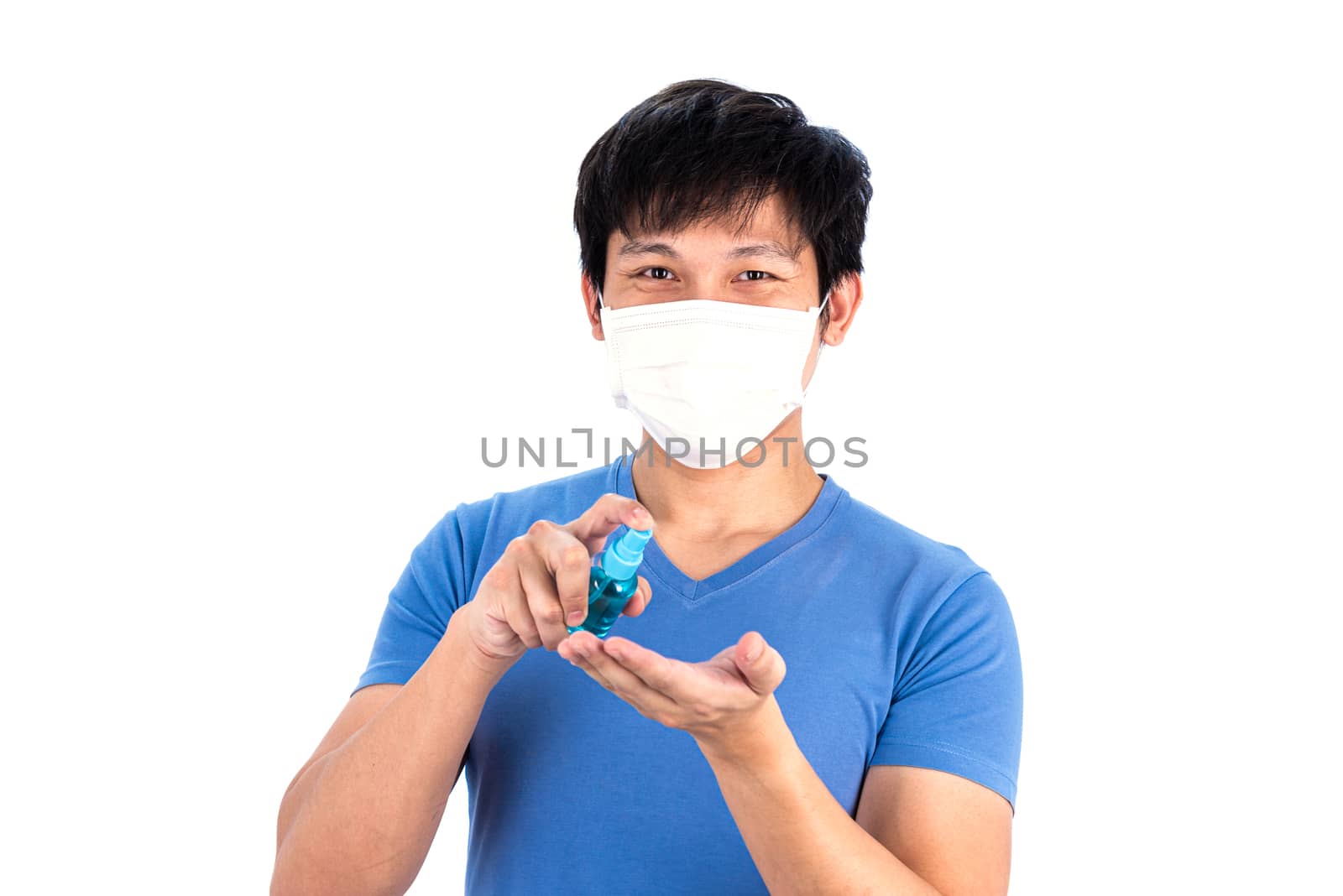 Asian young man in blue t-shirt top with medical mask and hand cleanser gel to protect COVID-19 with isolated on white background concept.