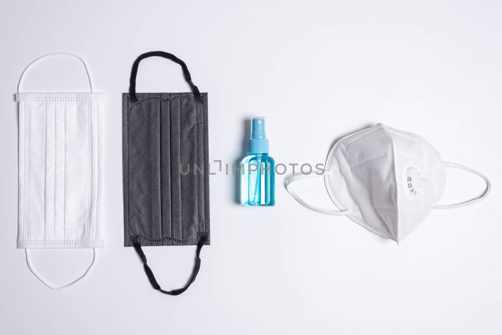 The equipment to protect COVID-19, multi color mask and hand cleaner gel with Isolated on white background concept.