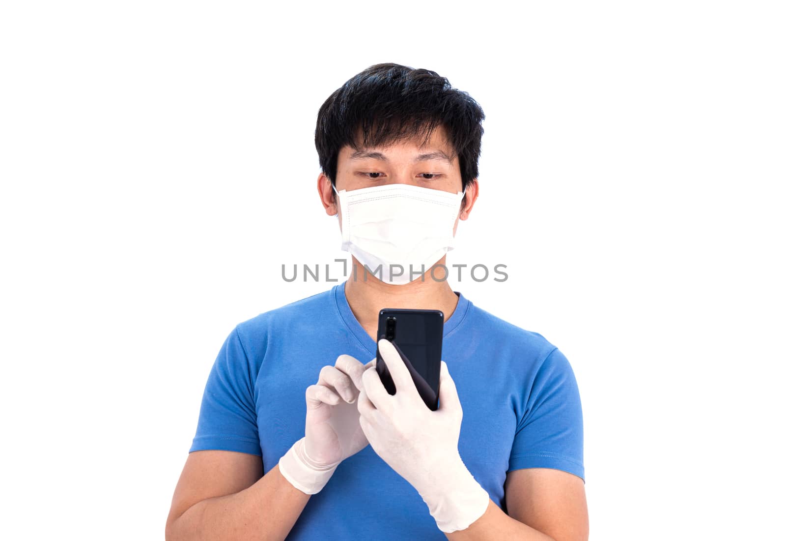 Asian young man in blue t-shirt top with medical mask and latex gloves to protect COVID-19 before working by mobile phone with isolated on white background concept.