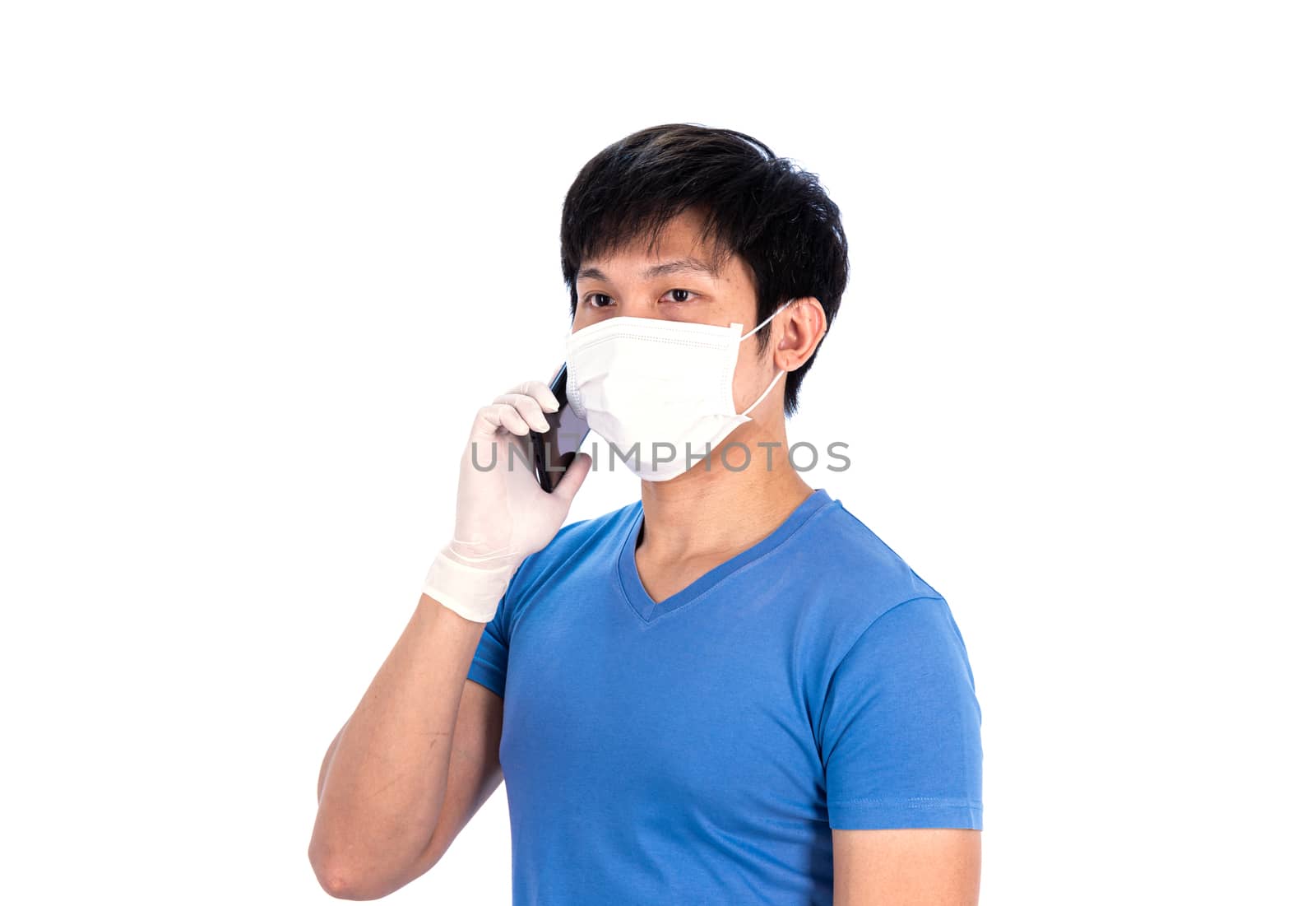 Asian young man in blue t-shirt top with medical mask and latex gloves to protect COVID-19 before working by mobile phone with isolated on white background concept.