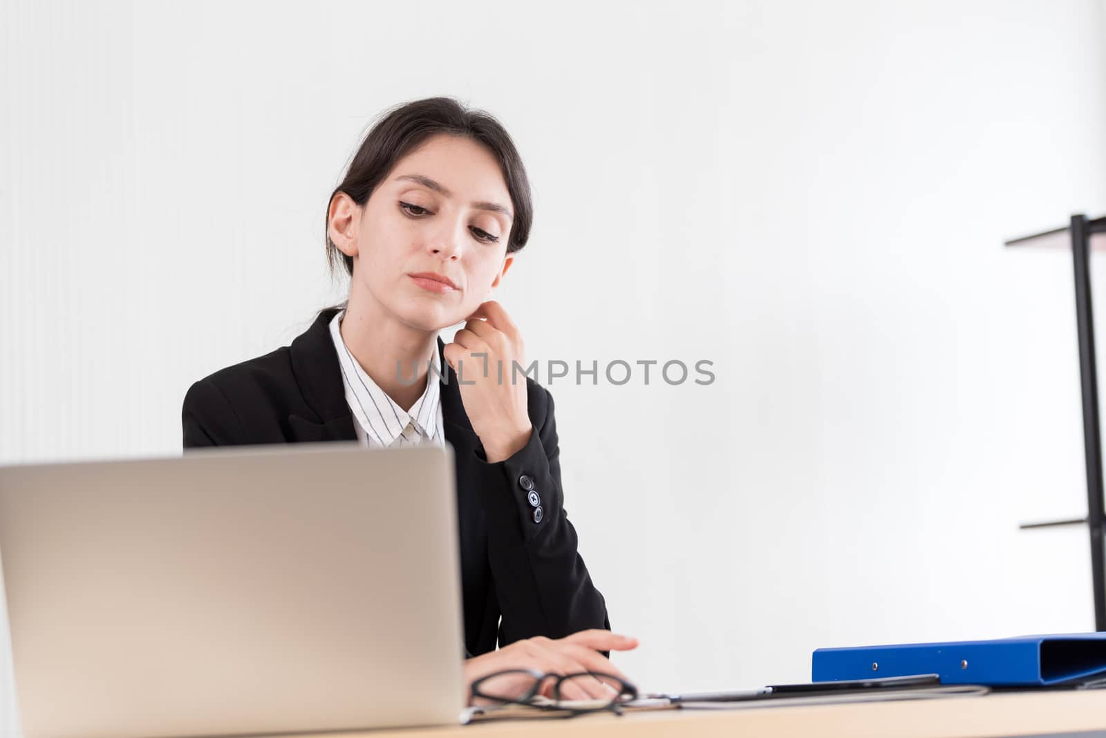 A businesswoman has concentrate working with and upset and unhappy.