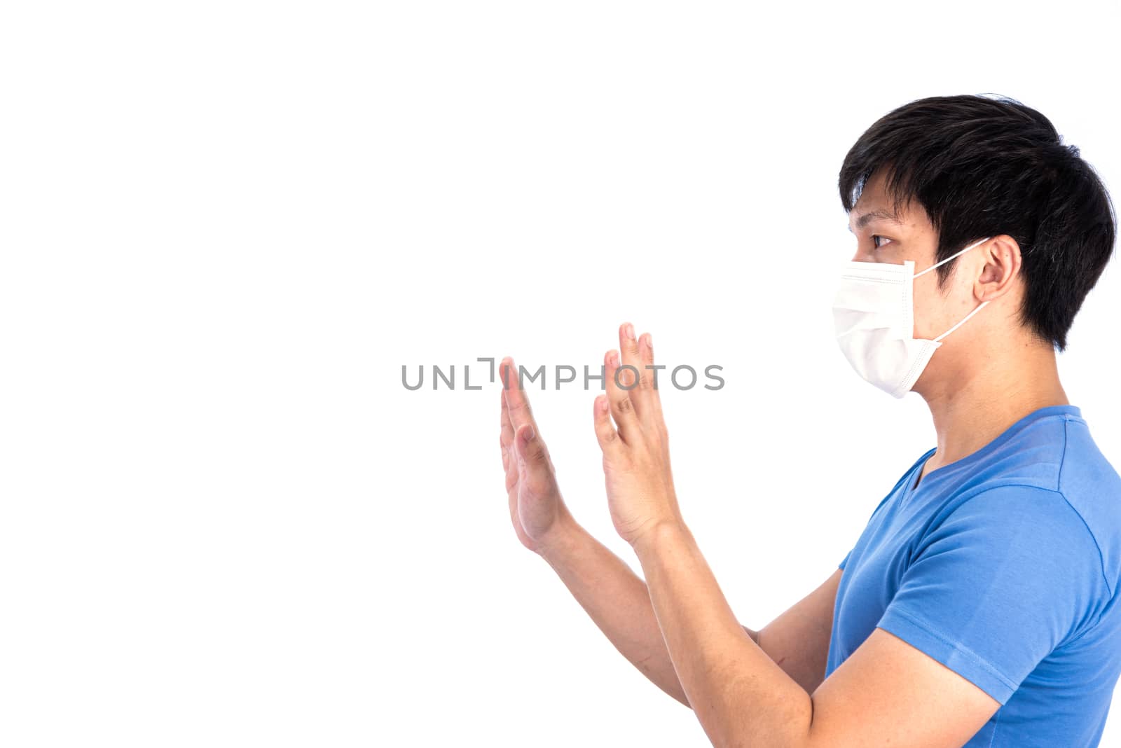 Asian young man in blue t-shirt top and medical mask to protect COVID-19 with isolated on white background concept.