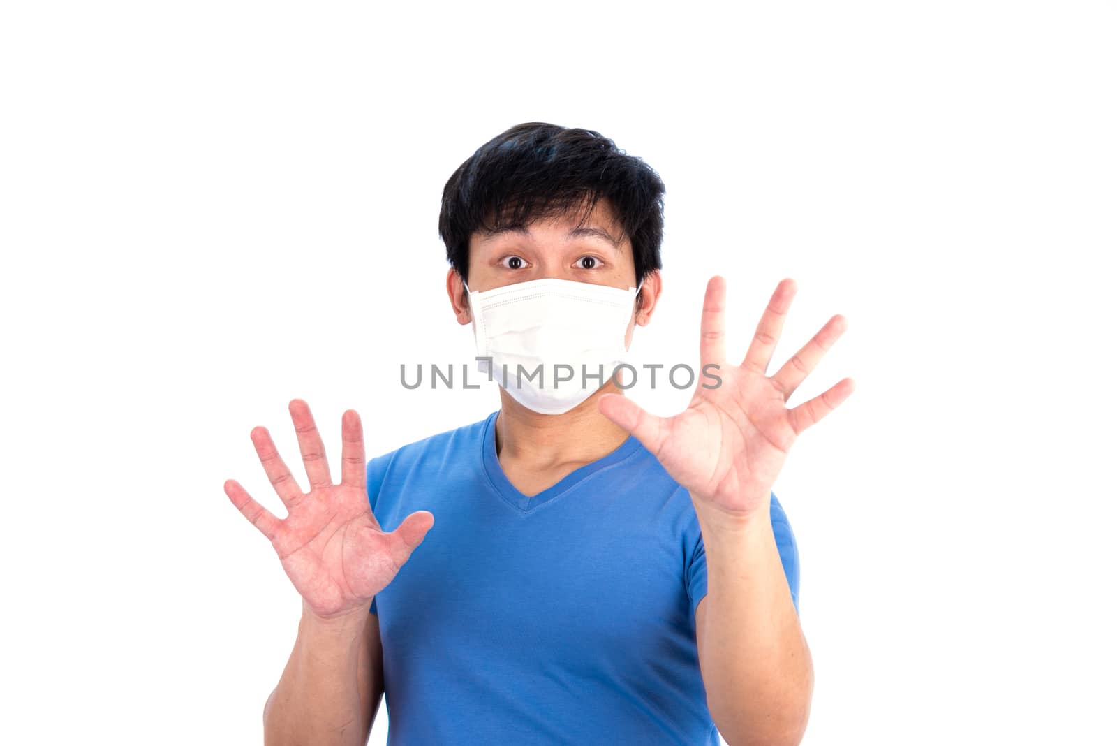 Asian young man in blue t-shirt top and medical mask to protect COVID-19 with isolated on white background concept.