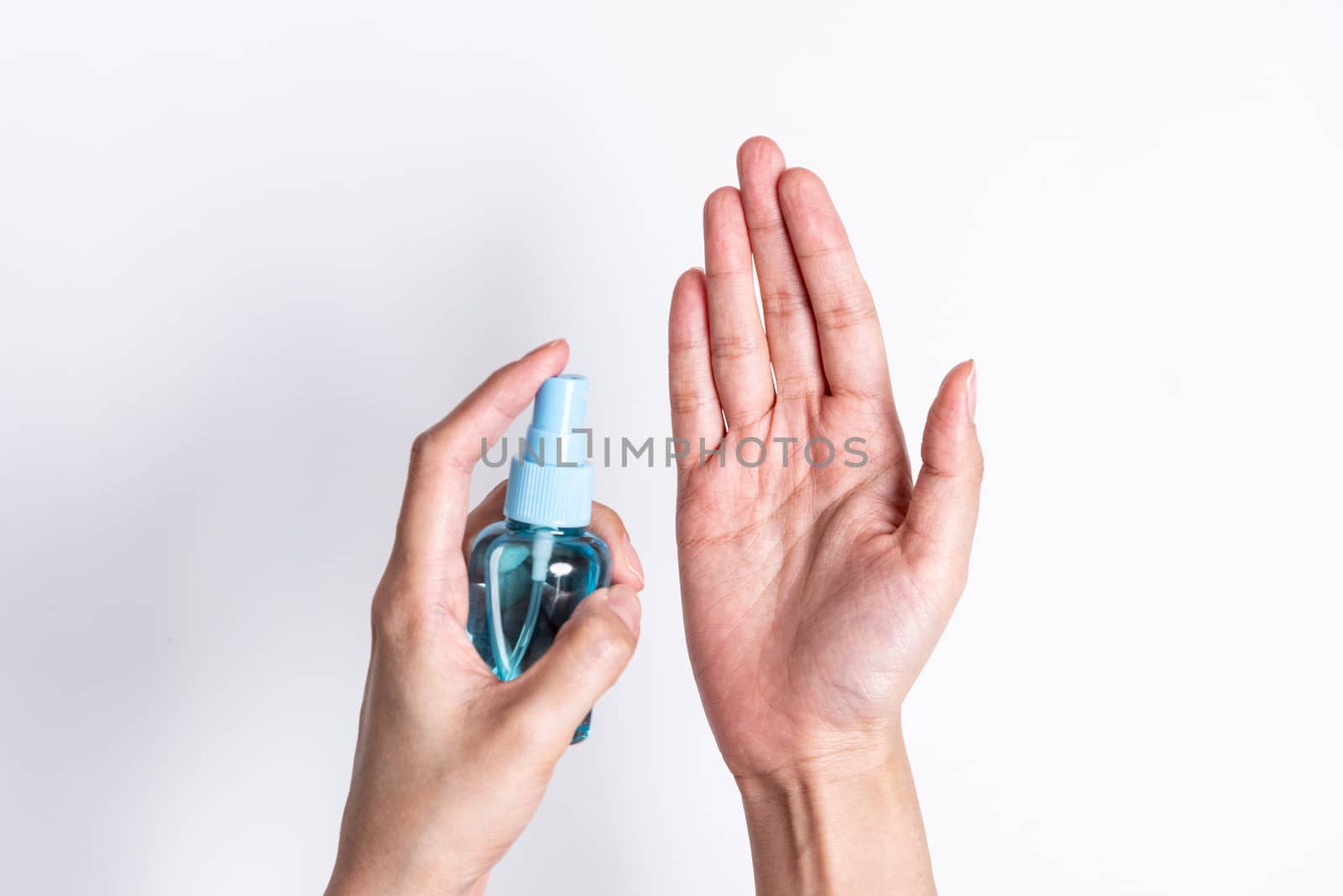 The Asian girl has cleaning hand by hand cleaner gel to protect COVID-19 with isolated on white background concept.