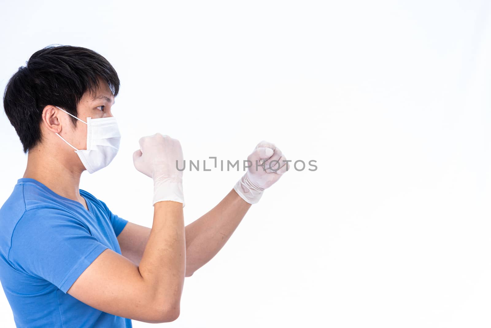 Asian young man in blue t-shirt top with medical mask and latex gloves to protect COVID-19 with isolated on white background concept.