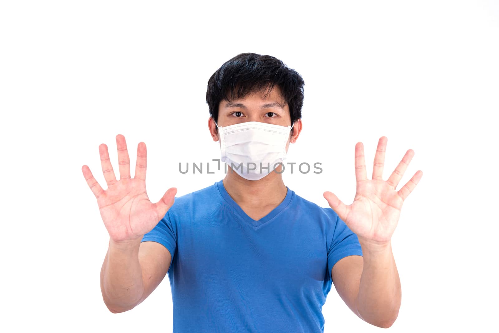Asian young man in blue t-shirt top and medical mask to protect COVID-19 with isolated on white background concept.
