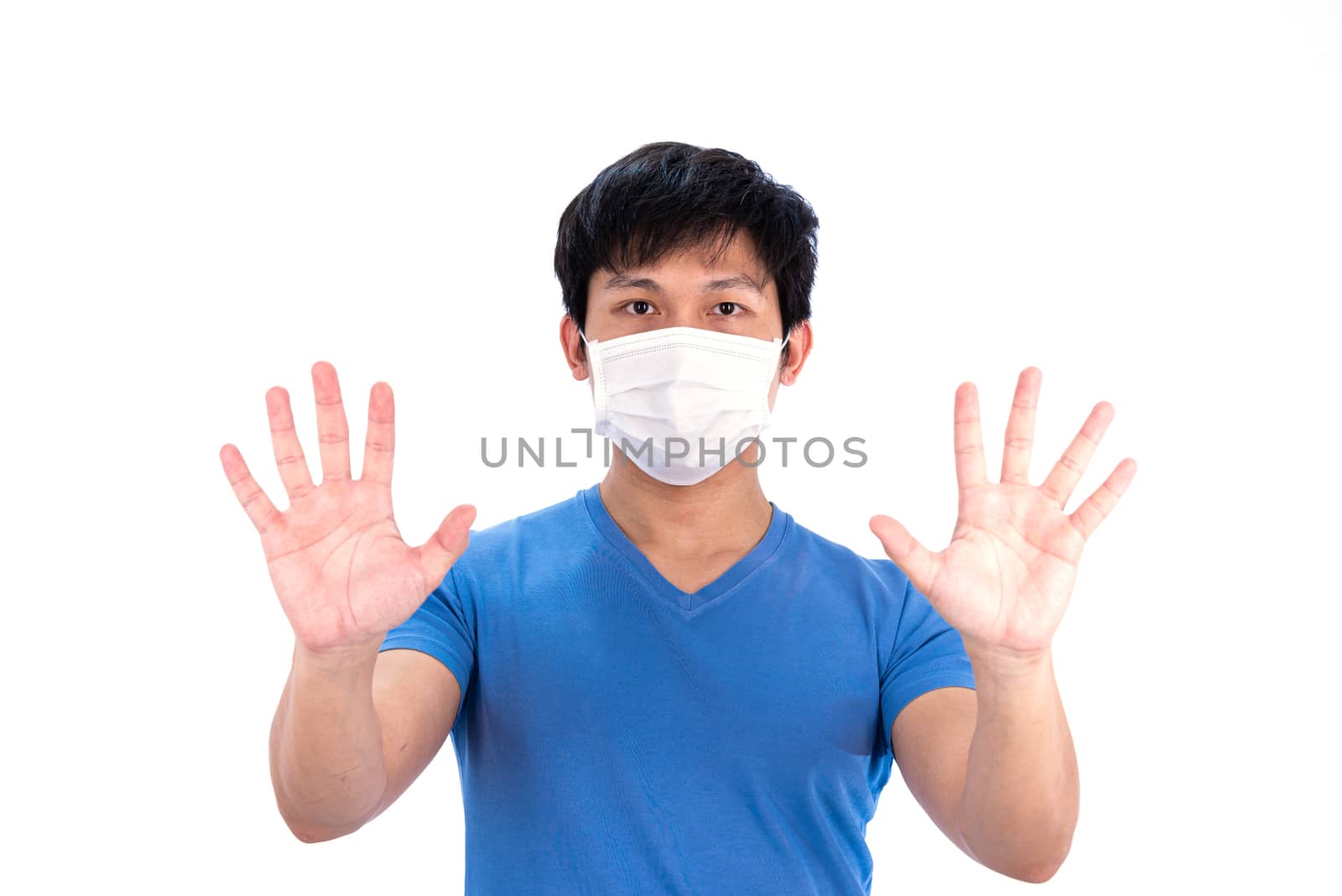 Asian young man in blue t-shirt top and medical mask to protect  by animagesdesign