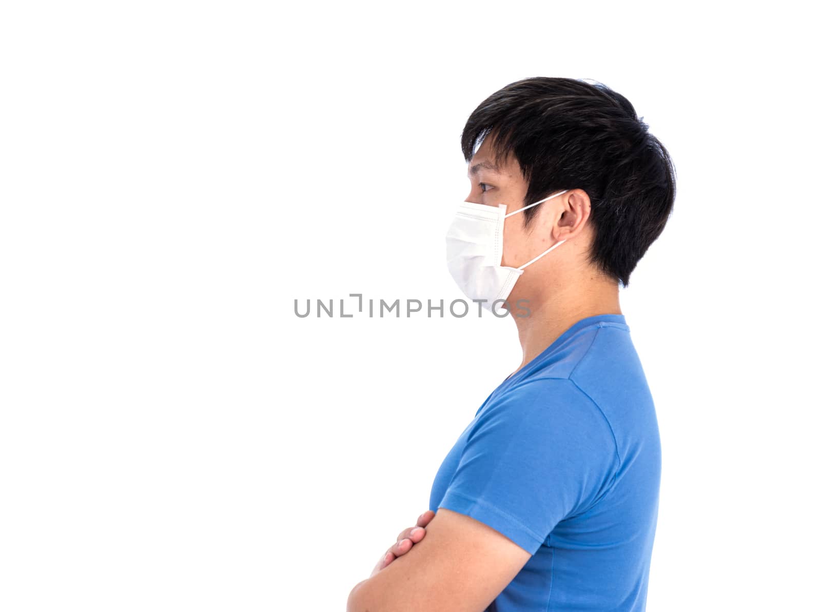 Asian young man in blue t-shirt top and medical mask to protect COVID-19 with isolated on white background concept.