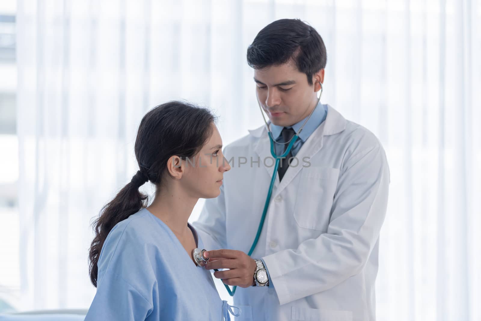 A doctor take care of sick patient woman at the hospital or medical clinic.