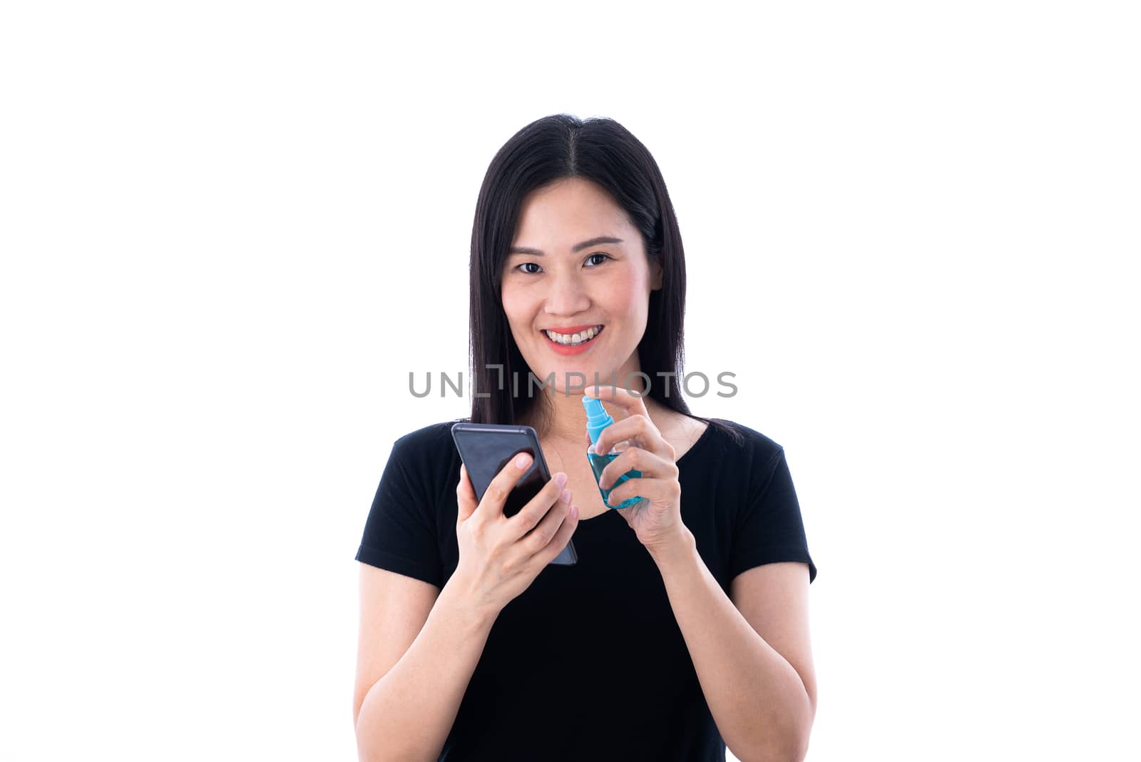 A beautiful Asian Thai woman cleaning a mobile with cleaner gel to protect COVID-19 isolated on white background.